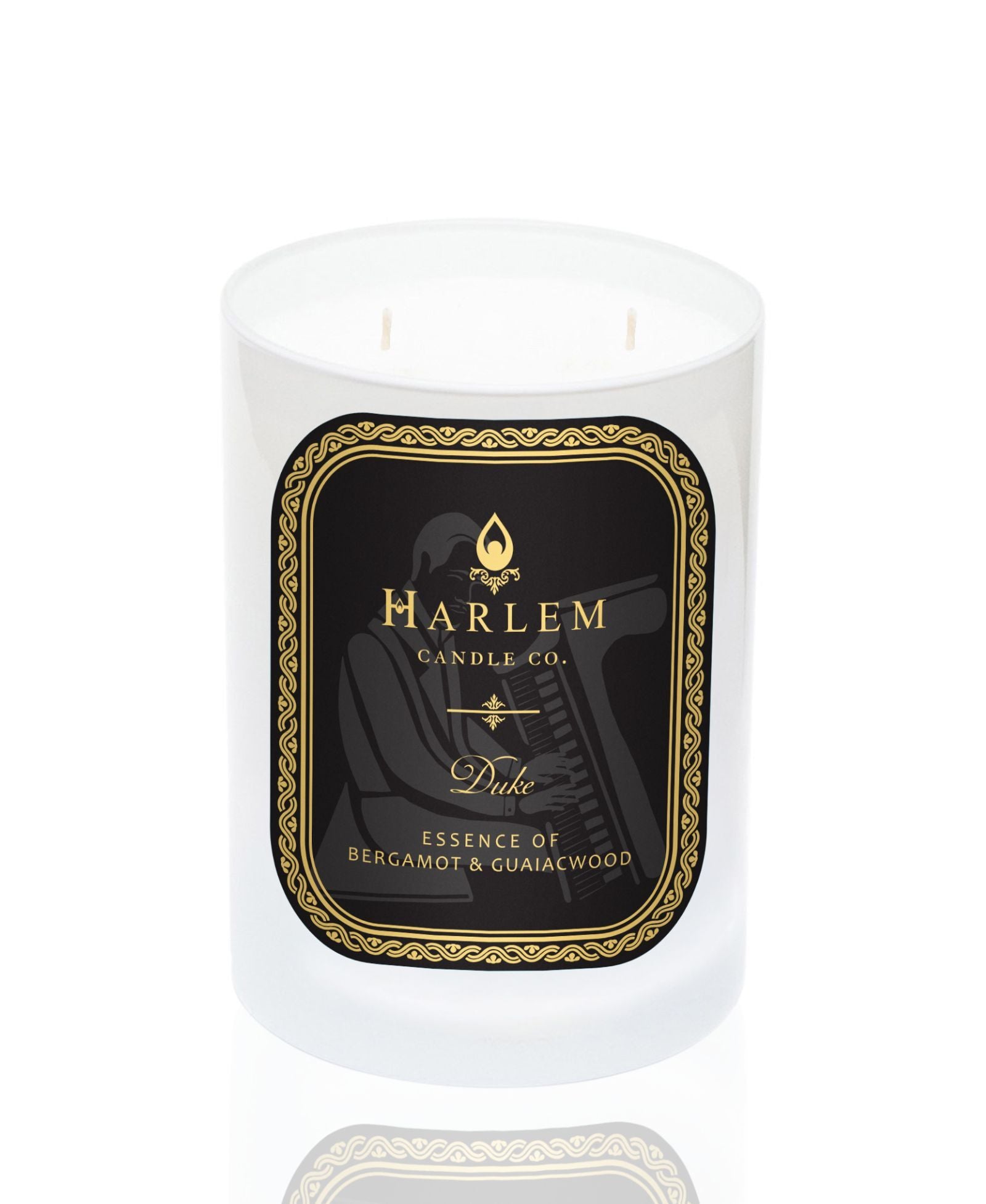 White 11 oz Duke candle with gold and Black label. This candle has 2 wick.  