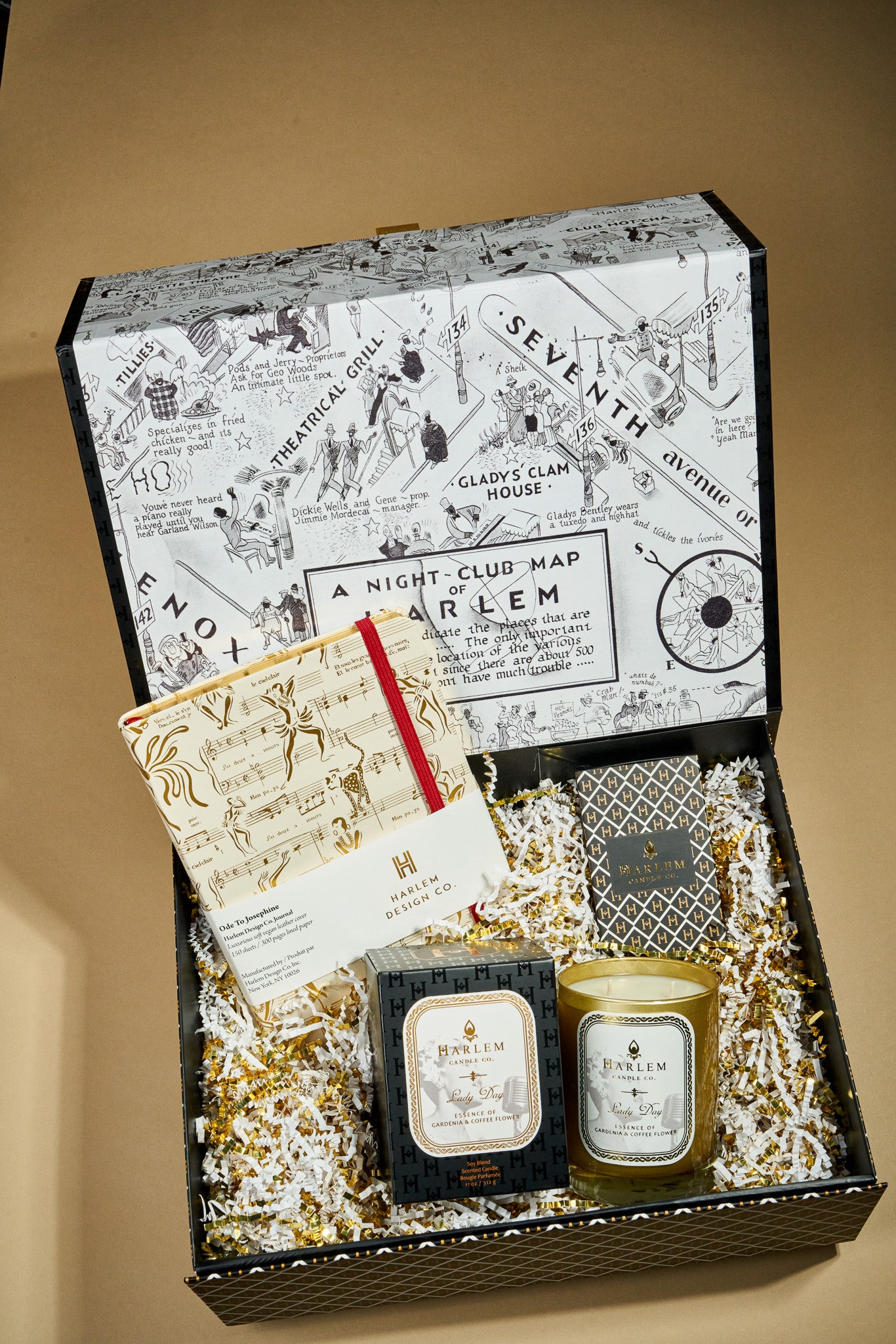 This is an image of our lady day, diary gift box which includes our 11 ounce lady day candle, cream, and gold Josephine Journal, and our black and white art deco inspired matches.This is an image of our lady day, diary gift box which includes our 11 ounce lady day candle, cream, and gold Josephine Journal, and our black and white art deco inspired matches.