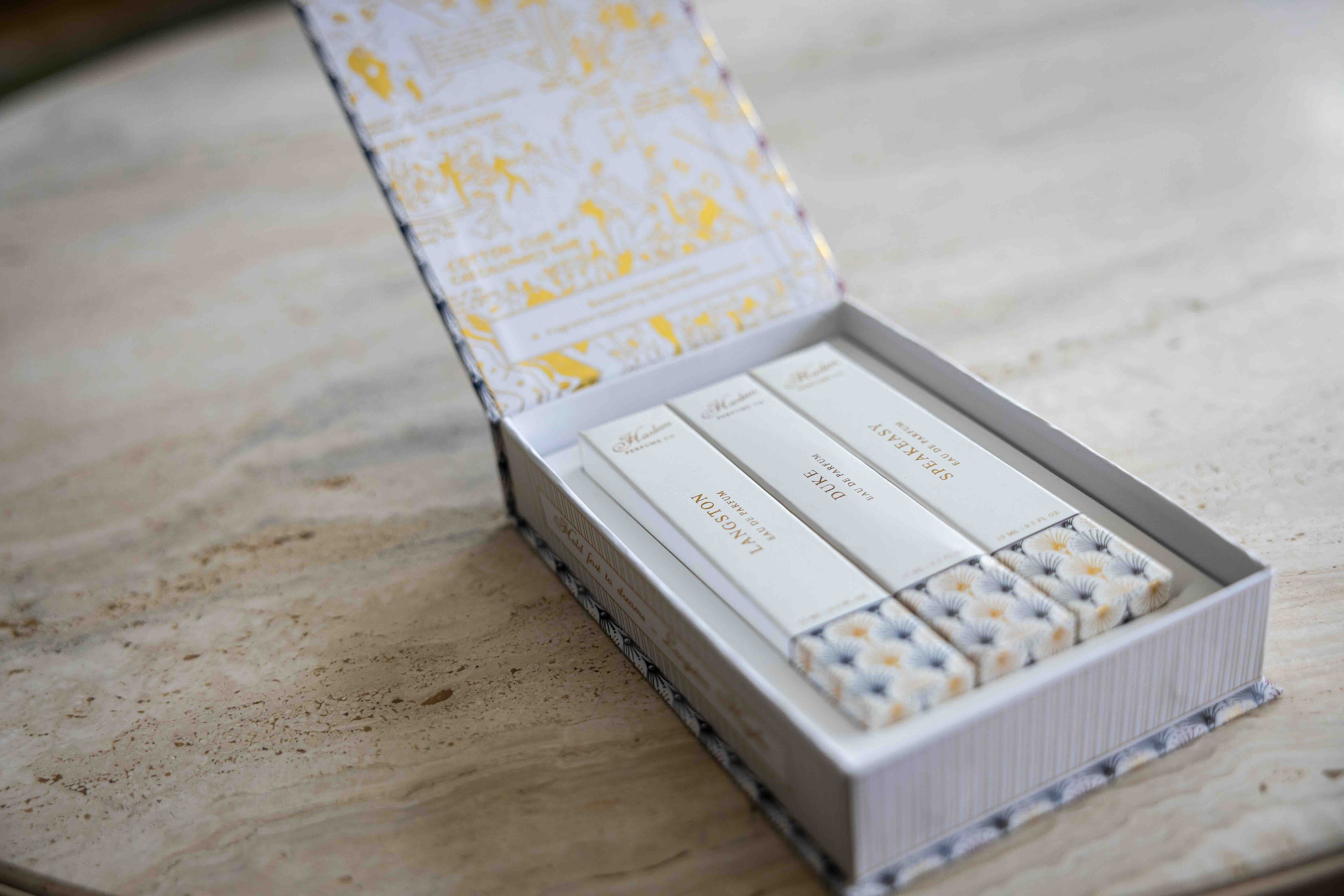 This is a lifestyle image of the perfume discovery box that contains the Langston, Duke and Speakeasy fragrances.