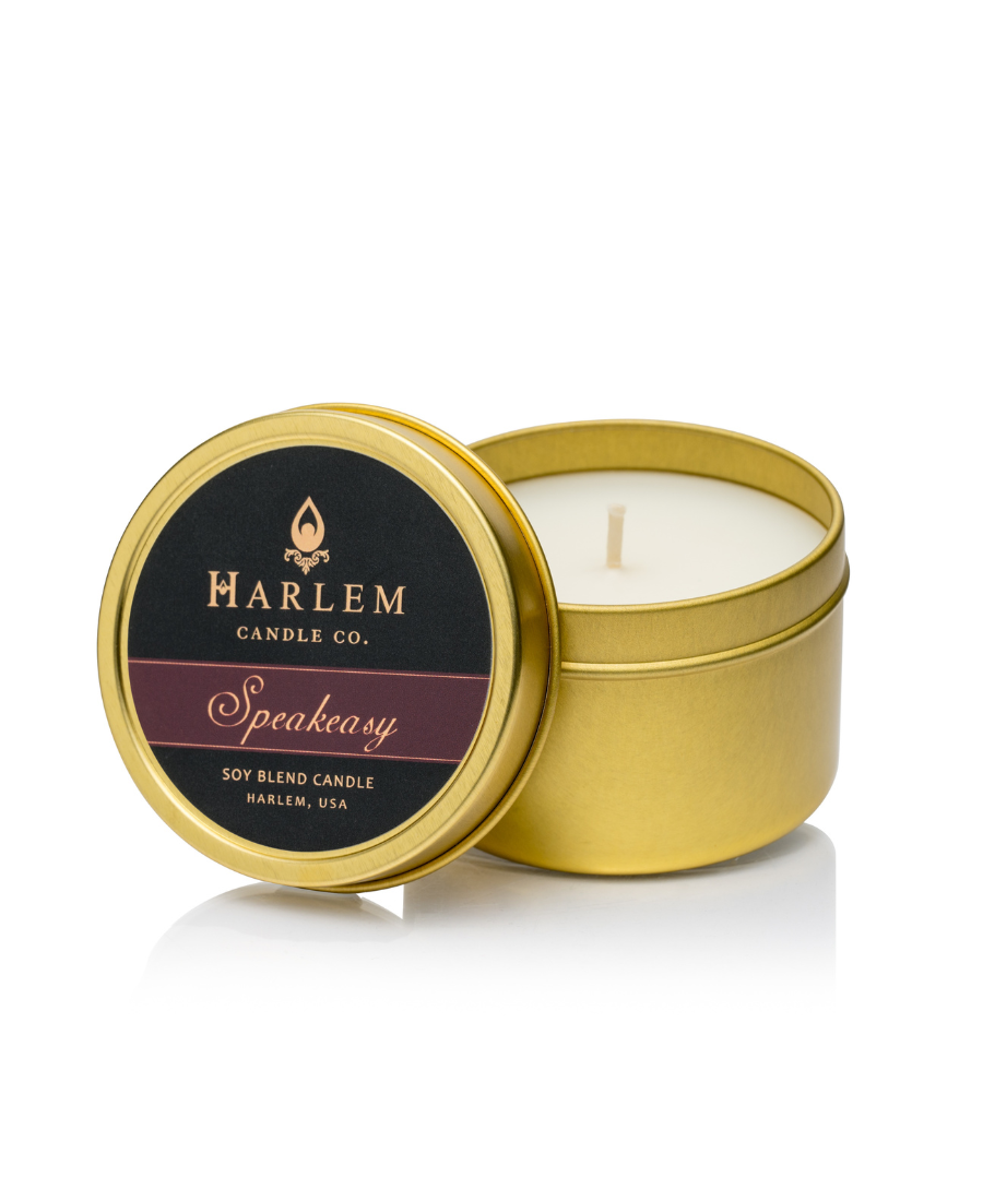 Our stunning Speakeasy travel candle in a gold metal tin.