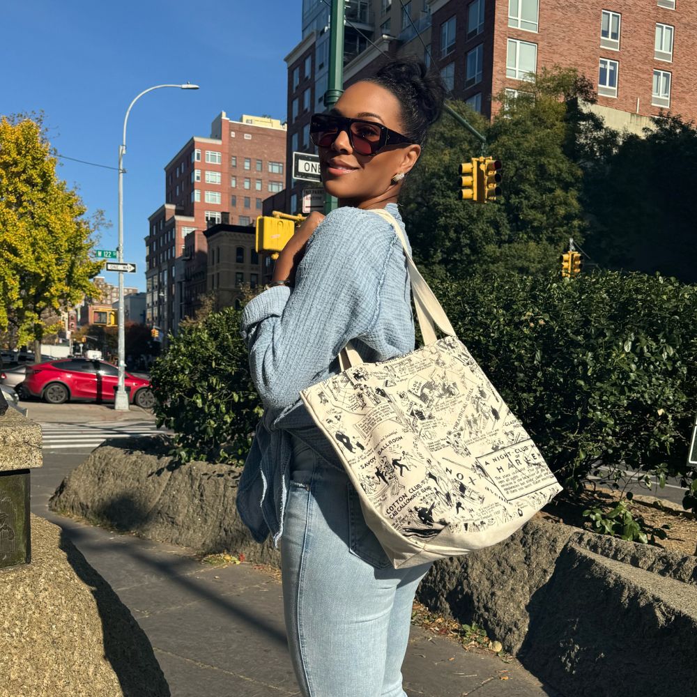 This is an image of a model with the NightClub Map of Harlem tote bag.